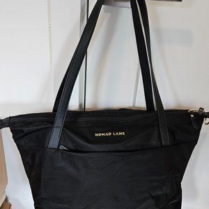 Nomad Lane Origami 4-in-1 Tote Convertible Black with gray interior.